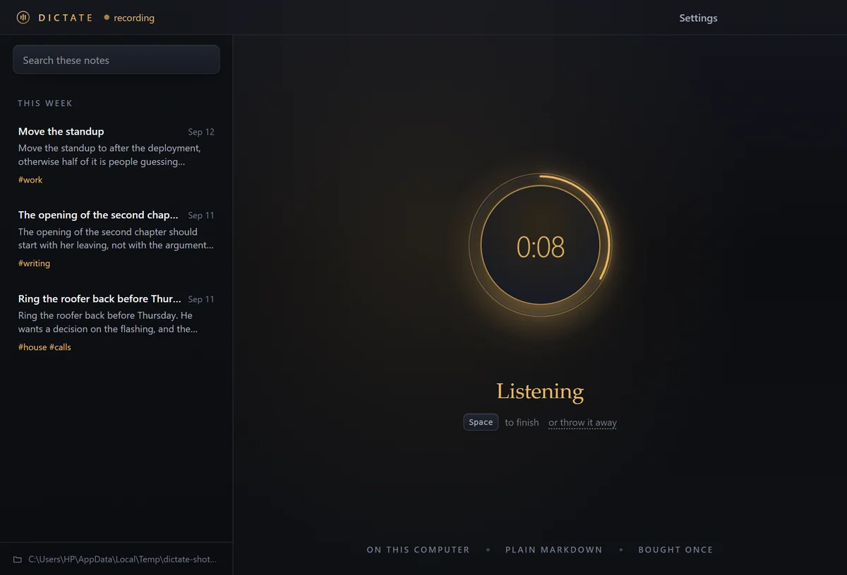 The Dictate window while recording, a warm glowing button with a running timer.